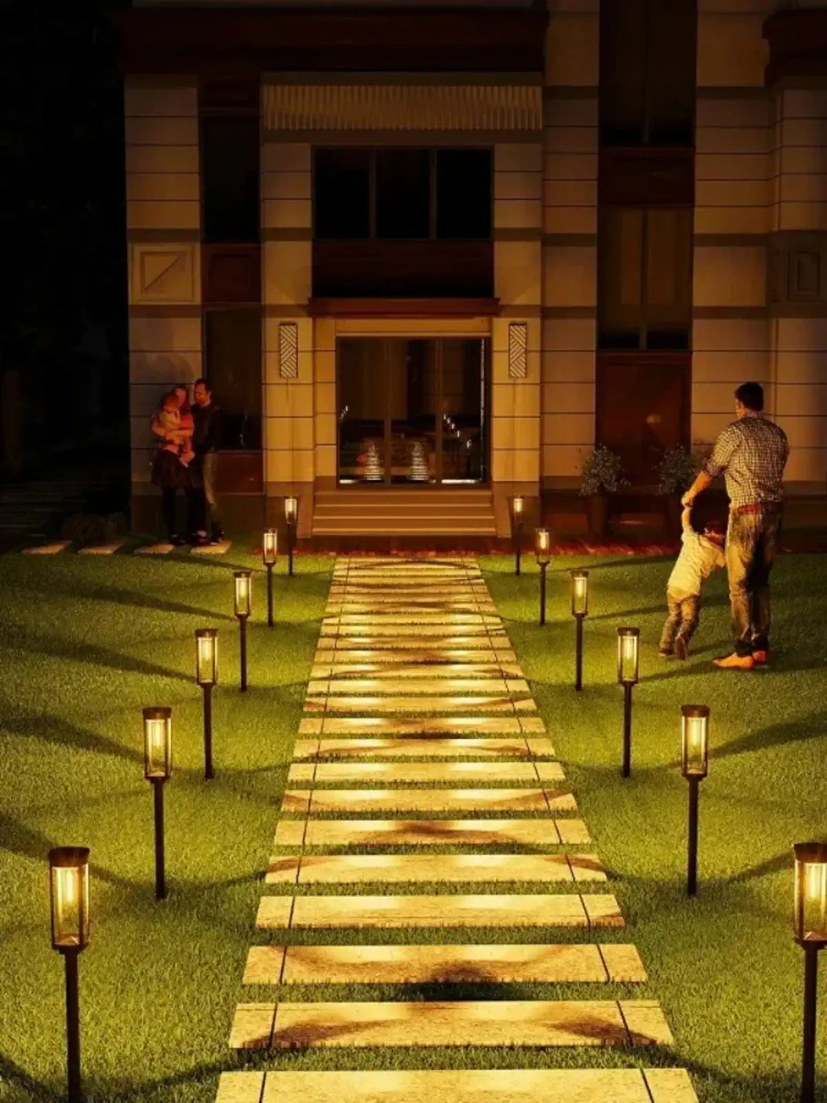 Garden walkway lined with solar lantern lights