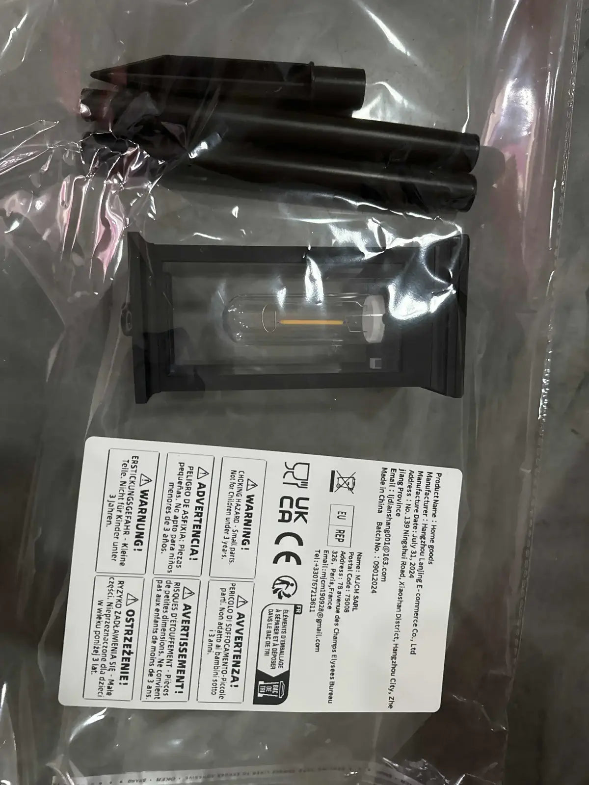 Solar lantern and pole components in retail packaging