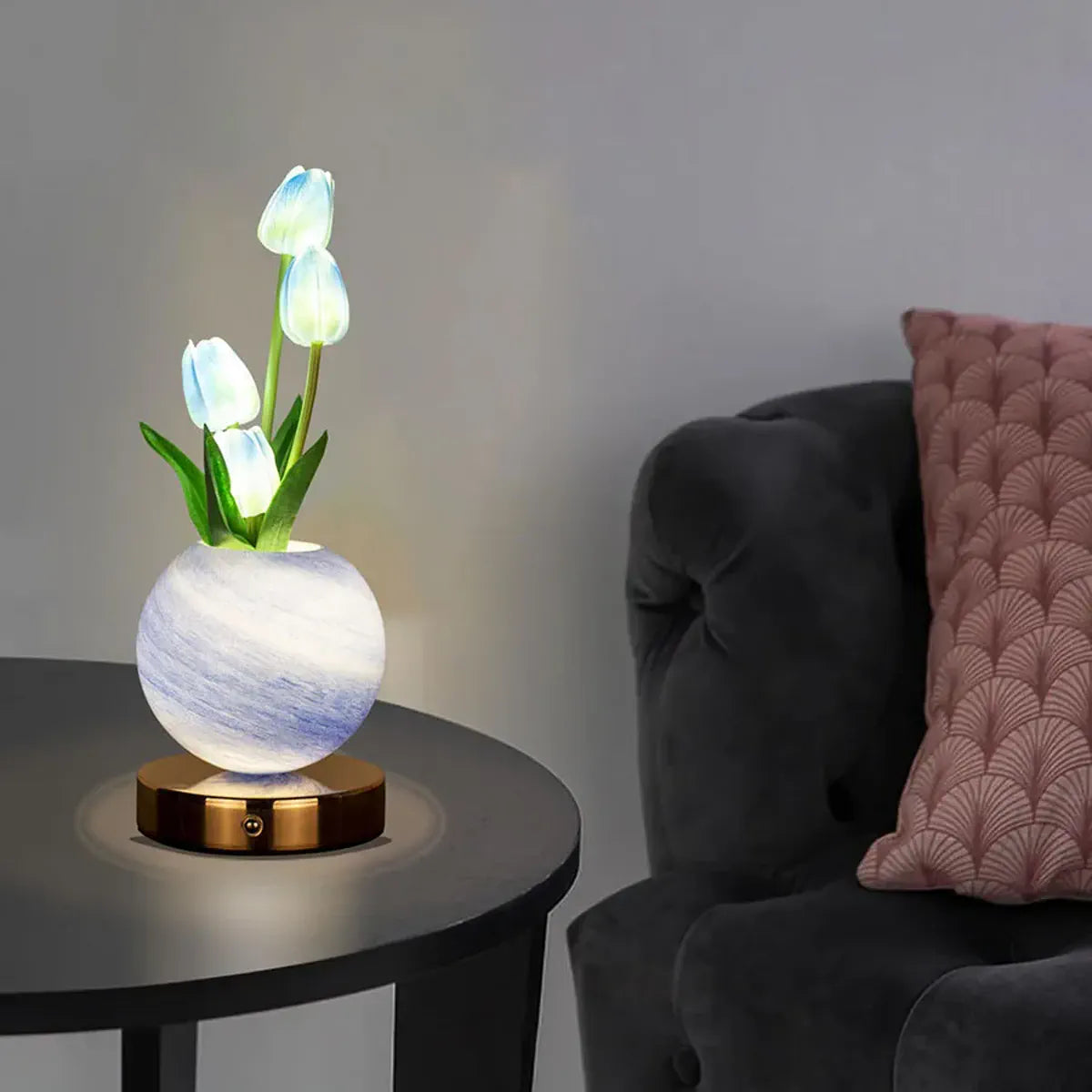 Blue tulip lamp glowing beside a sofa