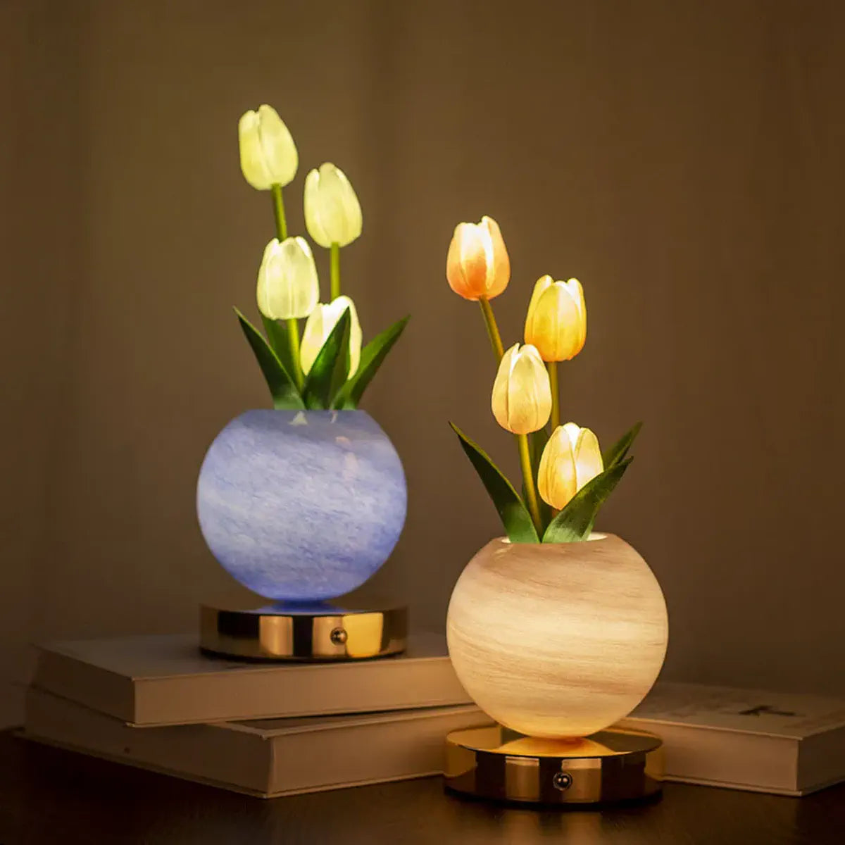 Blue and orange tulip lamps illuminating a tabletop