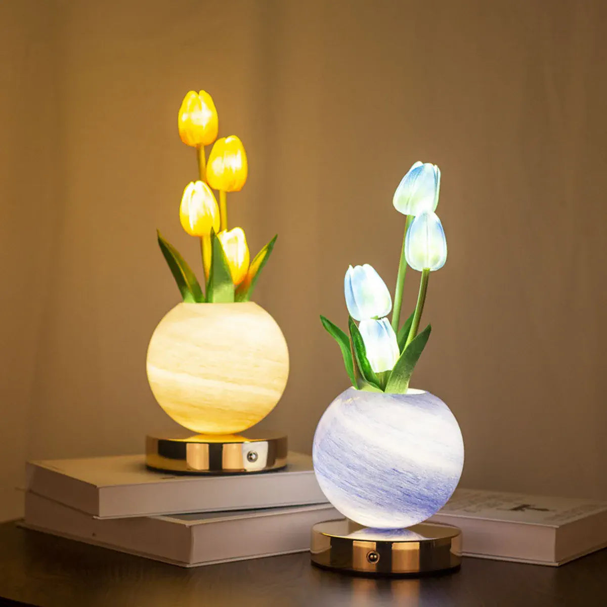 Three tulip lamps with illuminated blooms and round globes