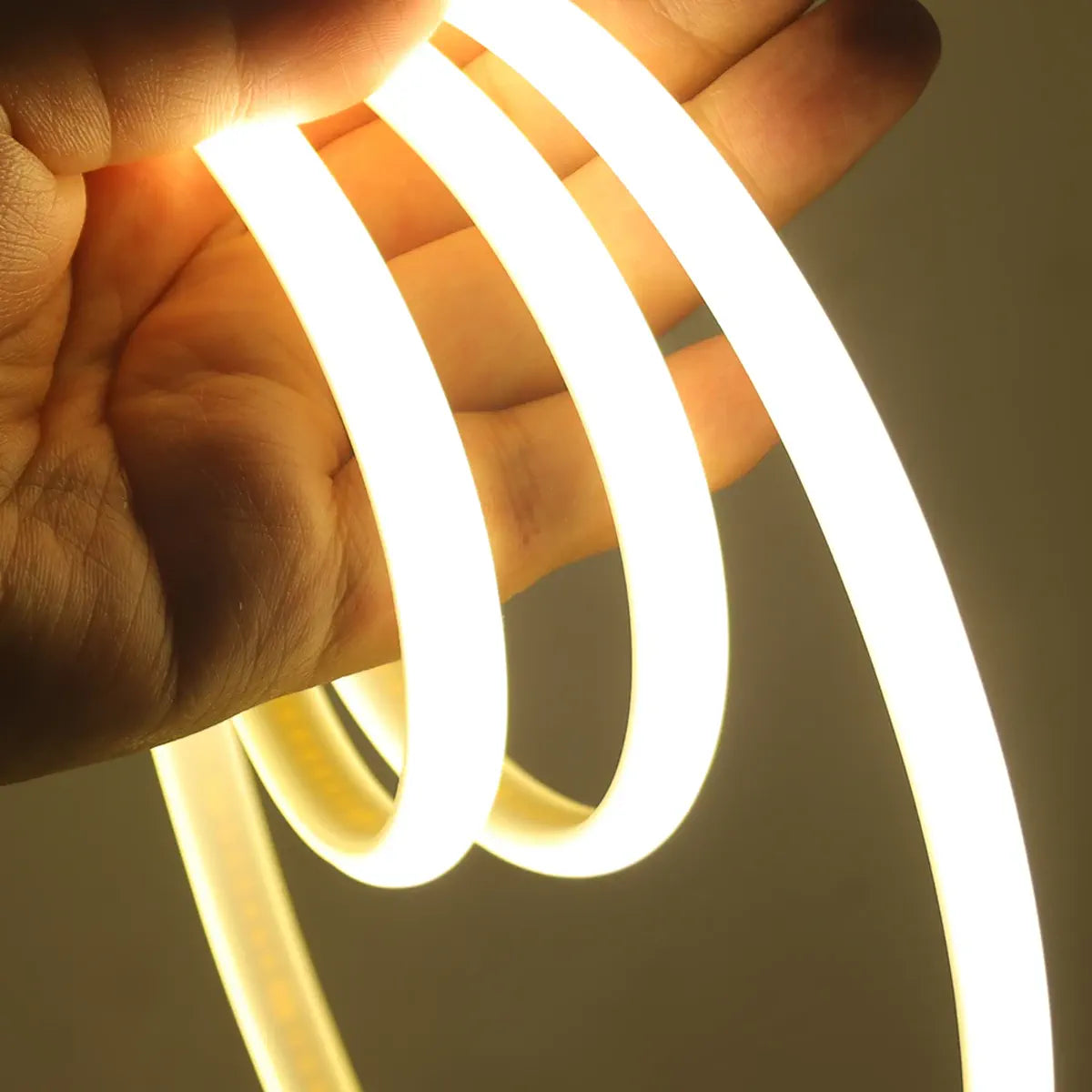 Flexible white COB neon strip wrapped over a hand