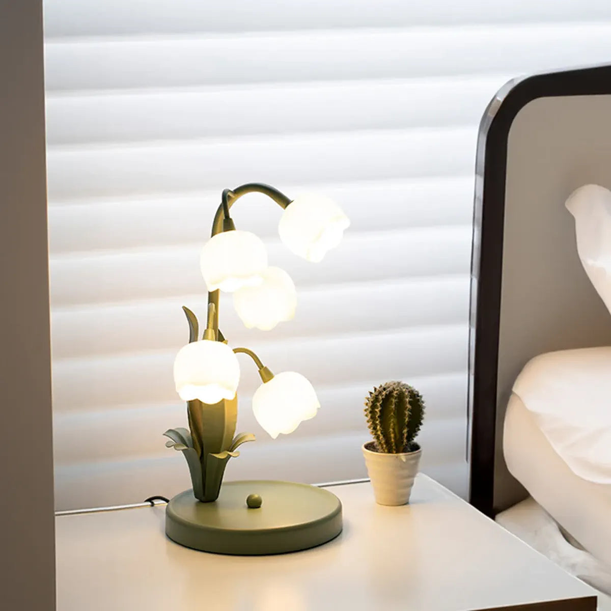 Floral table lamp beside a sofa