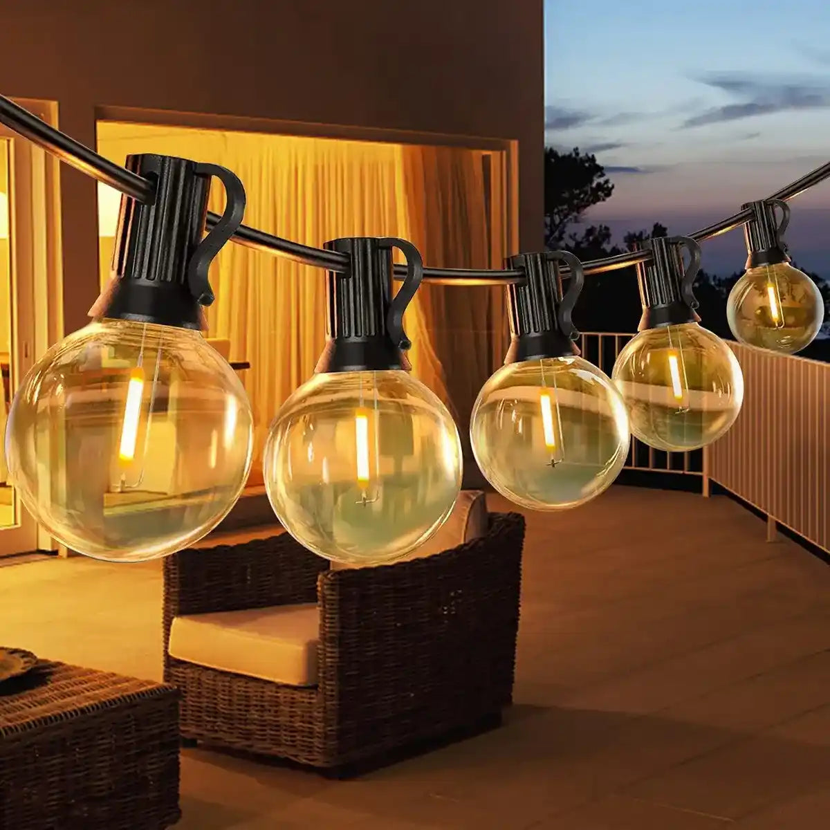Warm G40 string lights installed across a balcony