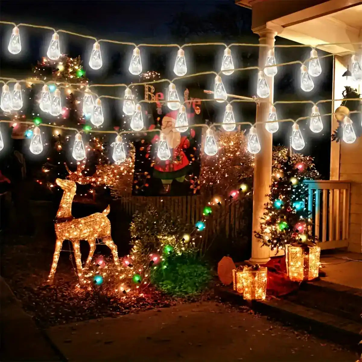 White teardrop string lights over an outdoor seating area