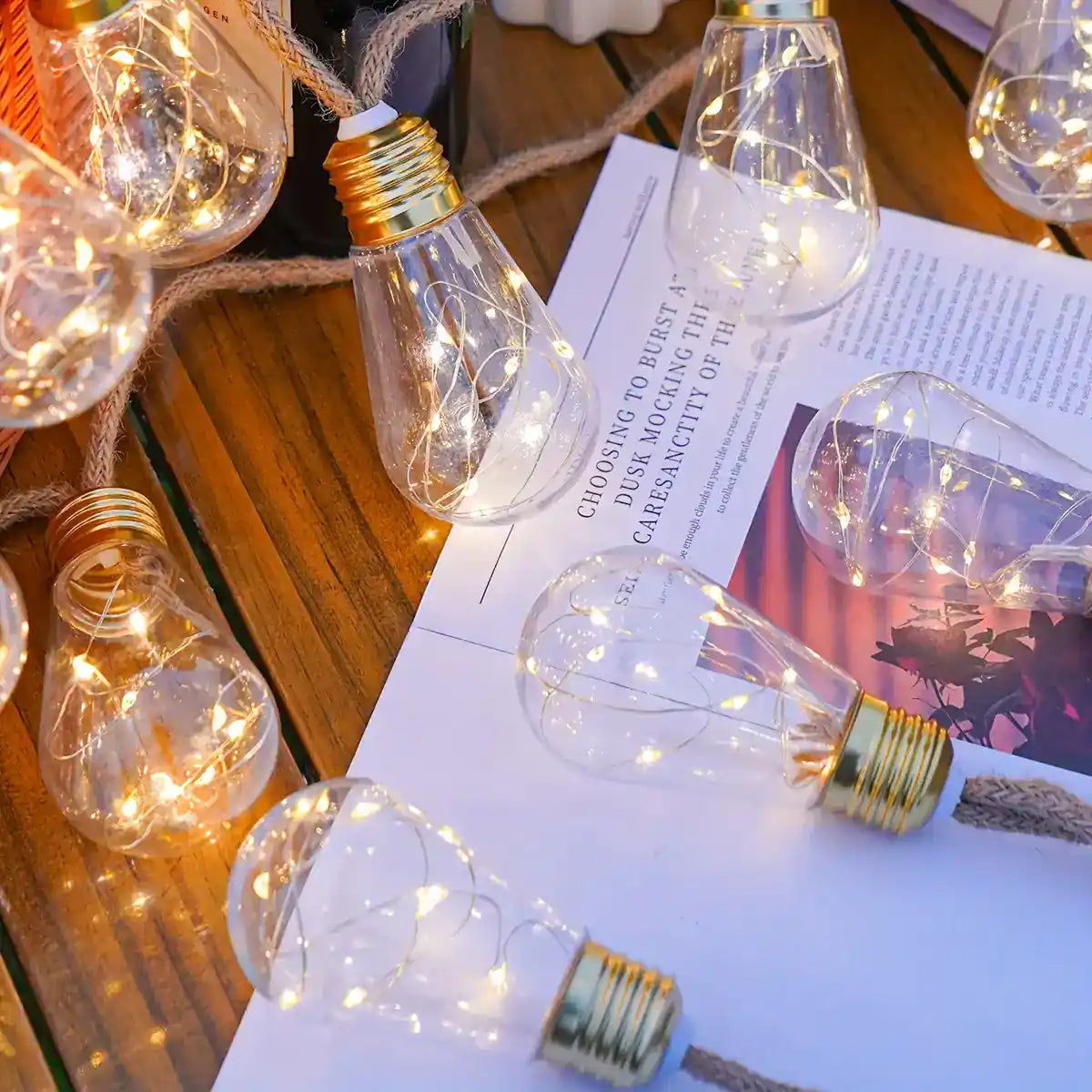 White fairy-light strands inside clear teardrop bulbs