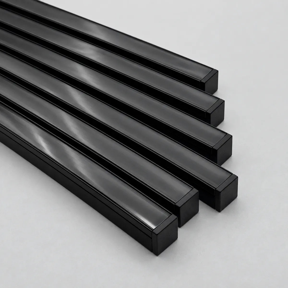 Close-up of black aluminum light bars and dark diffusers